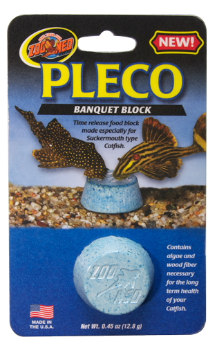 one round food block in packaging, two pleco eating it